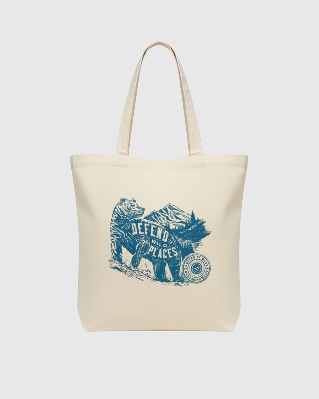 Beige tote bag with blue graphic design on a white background