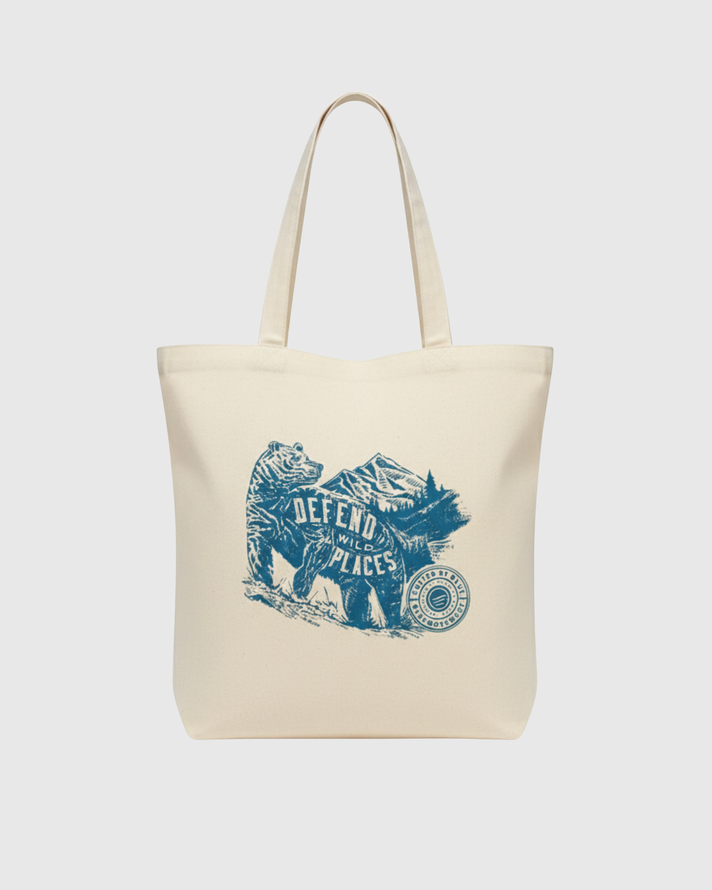 Beige tote bag with blue graphic design on a white background
